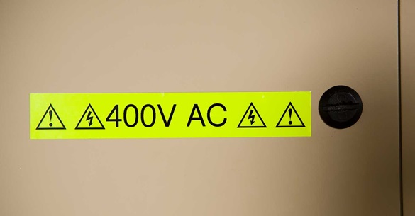 P-touch fluorescent TZe tape with voltage warning message